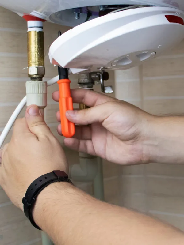 Plumber repairing pipe