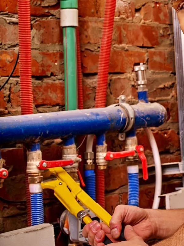 Plumber repairing pipe