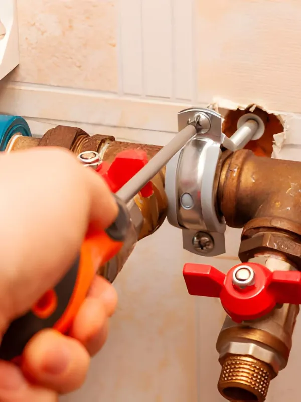 Plumber repairing pipe